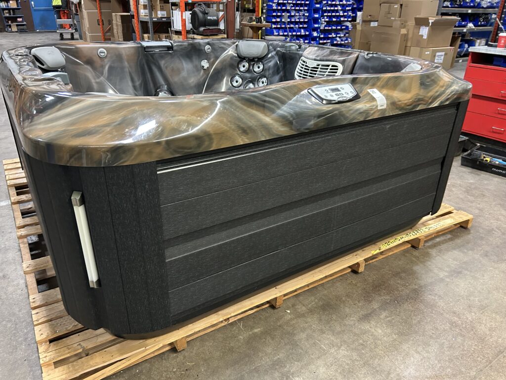 Jacuzzi J-345 hot tub UJ100898437 front exterior view with black cabinet and marbled shell finish