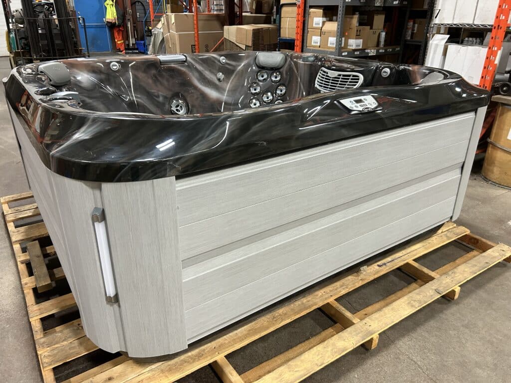 Jacuzzi J-365 hot tub UJ100881278 front exterior view in warehouse