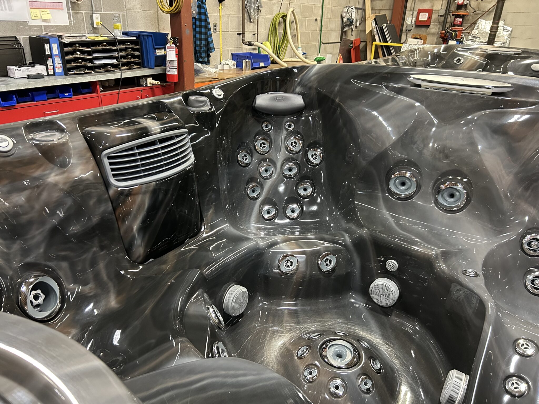 Jacuzzi J-475 interior seating layout with full-body hydrotherapy jet system