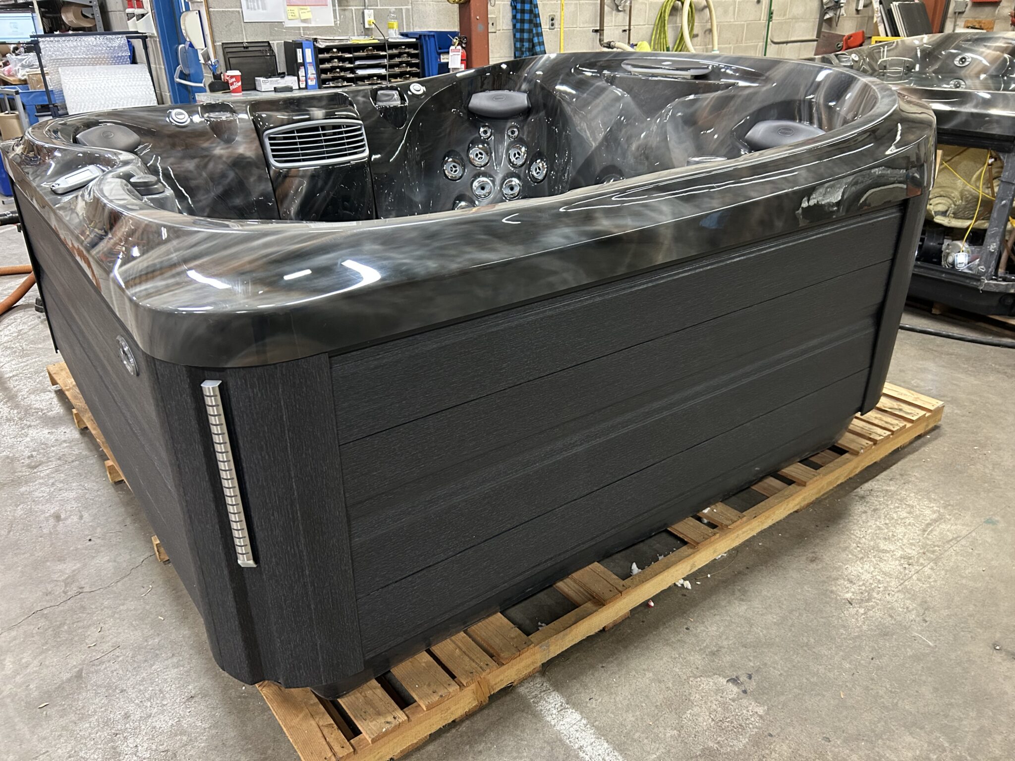 Jacuzzi J-475 side cabinet detail showing modern synthetic panel design