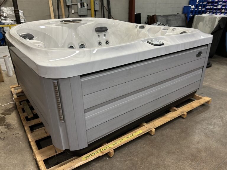 2022 Jacuzzi® J-475™ front exterior view with white shell and modern cabinet design