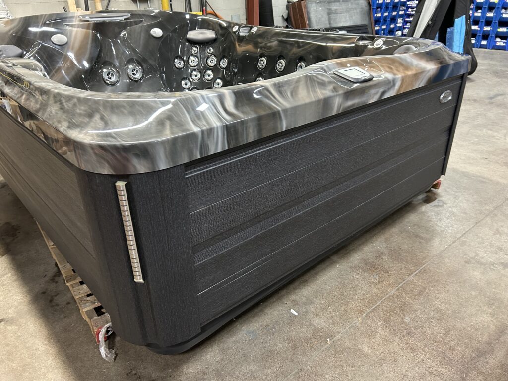 2021 Jacuzzi J-495 front exterior with synthetic cabinet and waterfall feature