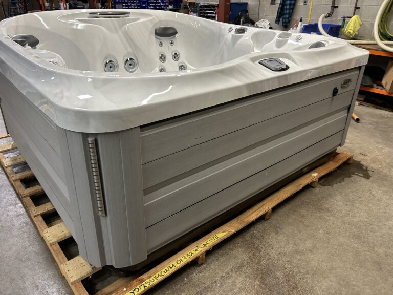 2022 Jacuzzi® J-475™ front exterior view with modern cabinet finish and sculpted shell